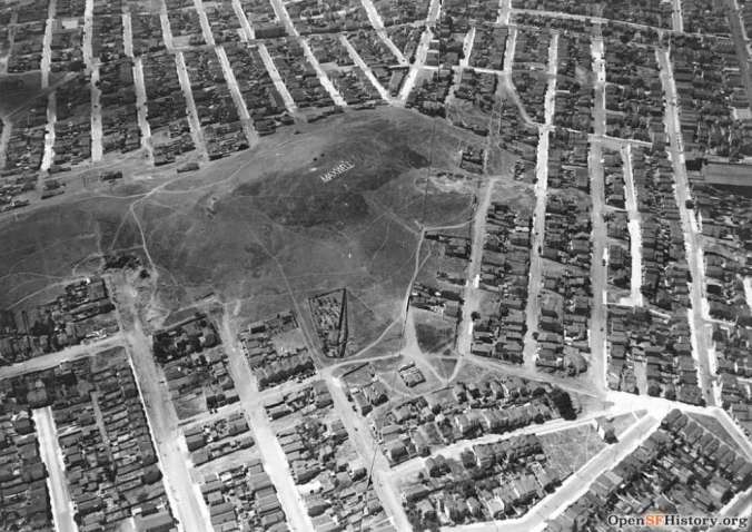 Bernal Hill, circa 1924. View looking south, roughly from above Precita Avenue,, Folsom Street at left; Coso to the right. The ad on the hilltop is for Maxwell Automobiles. Courtesy of OpenSFHistory.org.
